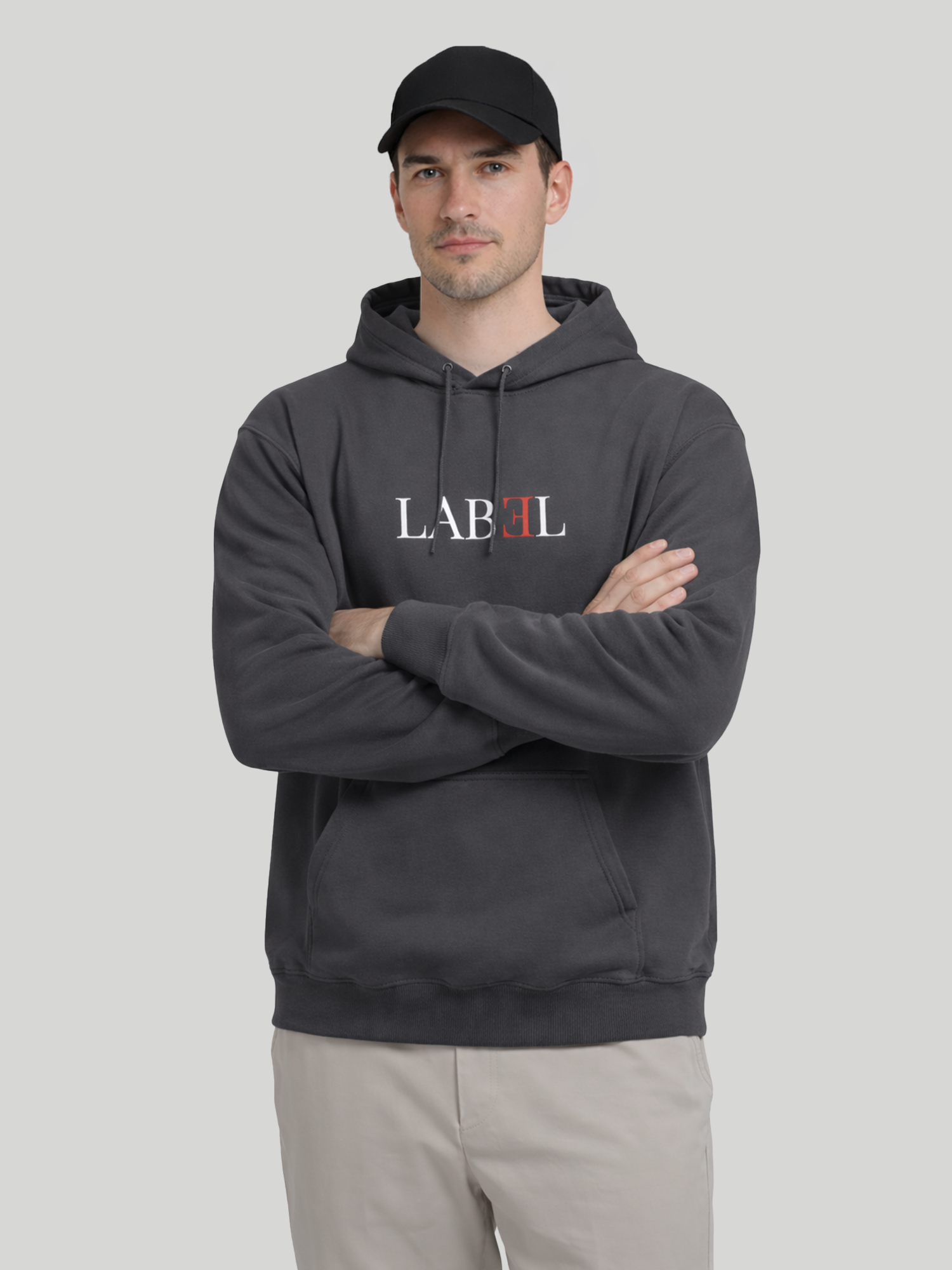 LABEL charcoal hoodie for men front view with crossed arms and minimal print