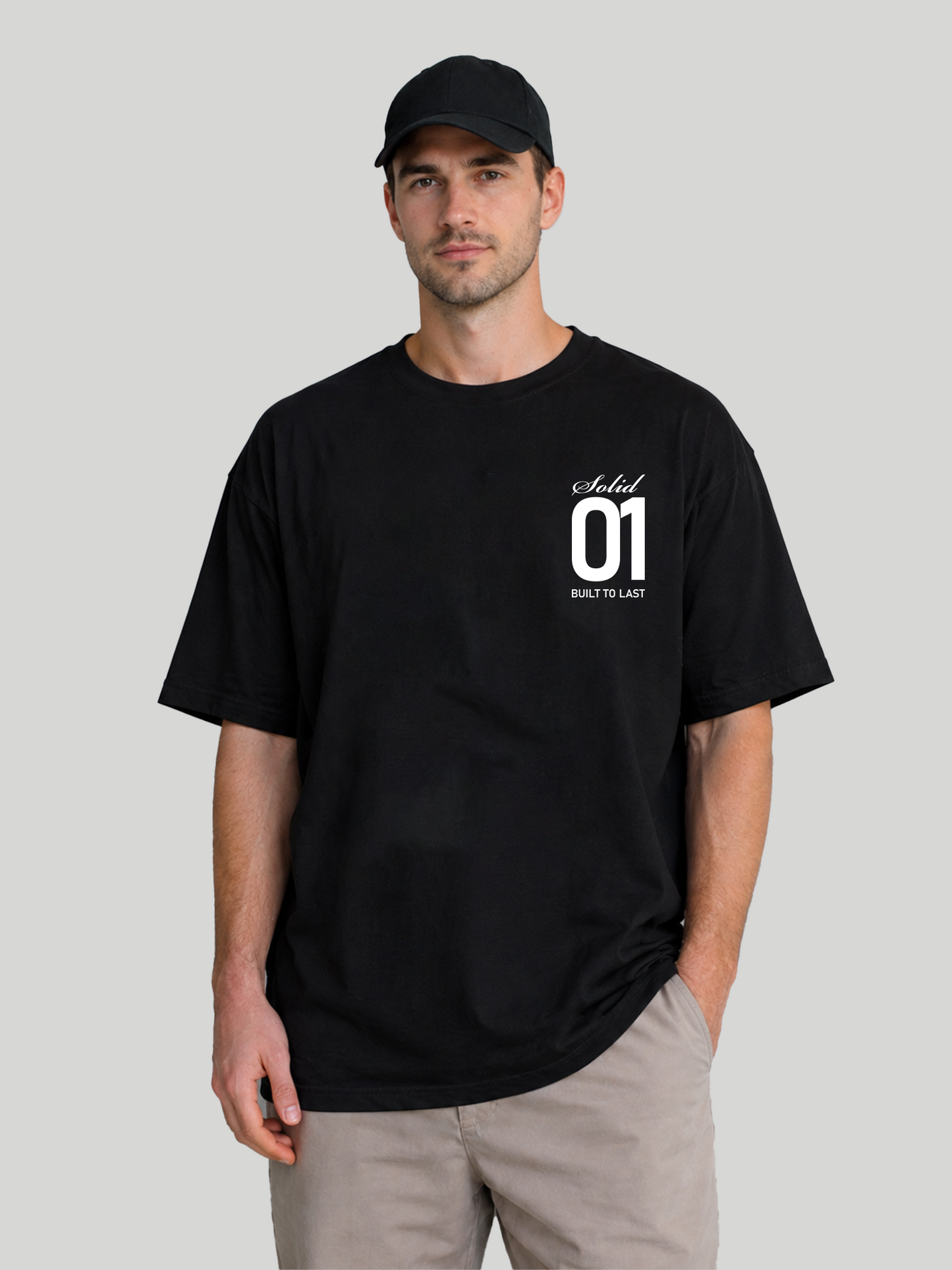 Men's Black Oversized T-Shirt Front View with Cap – Solid 01 Graphic Streetwear Tee
