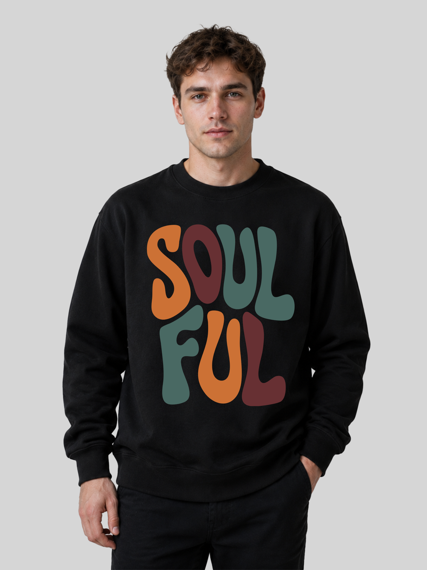A front view of a male model wearing a black crewneck sweatshirt with a large, colorful retro typography print reading "SOULFUL" across the chest.