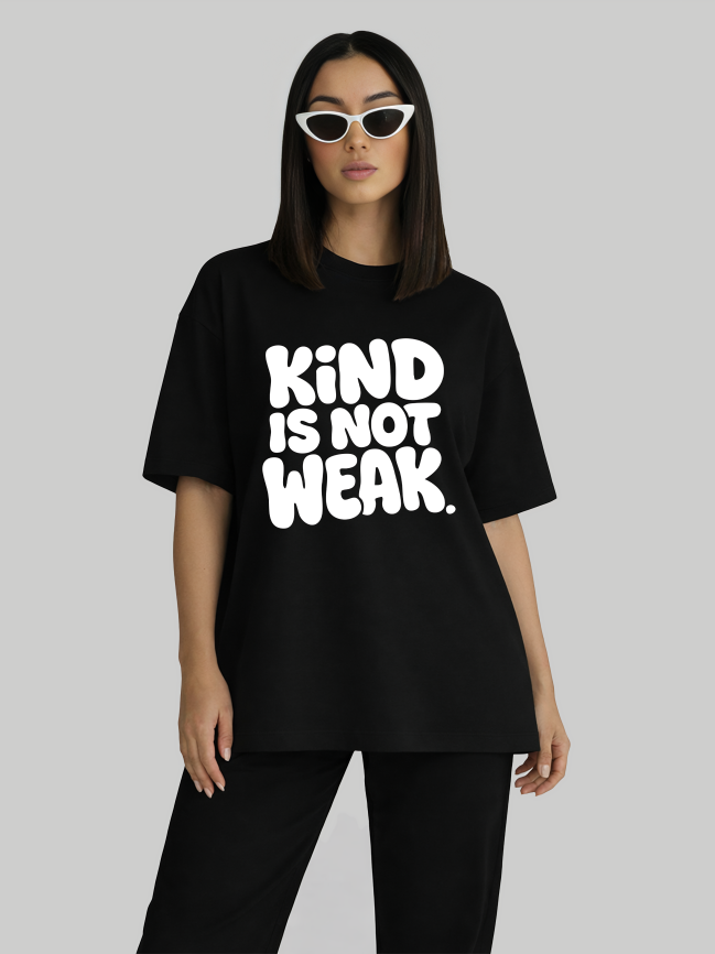 Black oversized graphic t-shirt for women with Kind Is Not Weak slogan front view