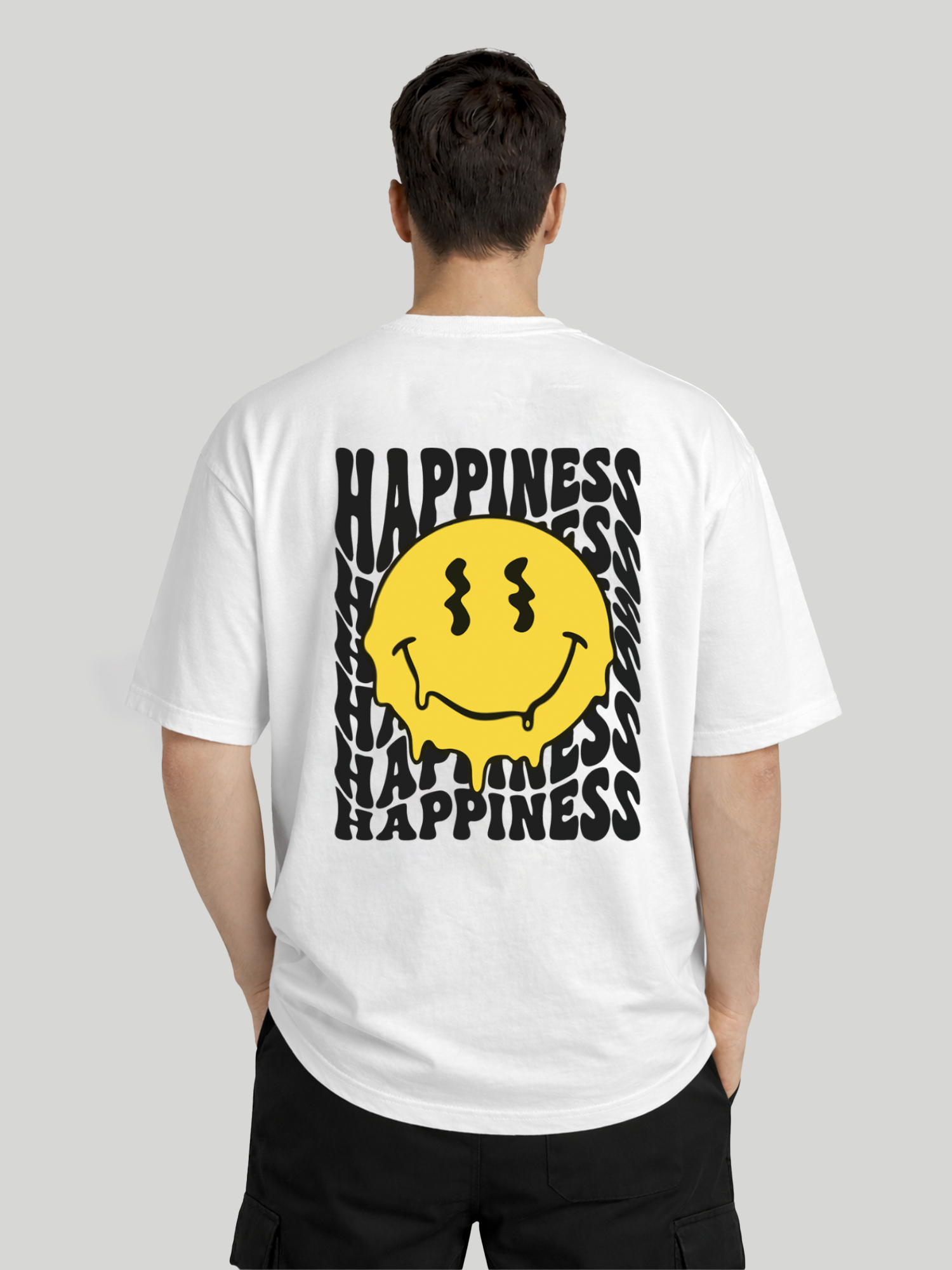 Back view of man wearing white oversized t-shirt with Happiness back graphic and yellow dripping smiley print