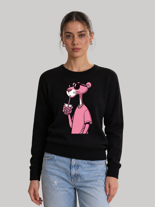 A straight studio shot of a female model wearing a black graphic sweatshirt with a custom printed Pink Panther design, paired with light blue denim jeans.