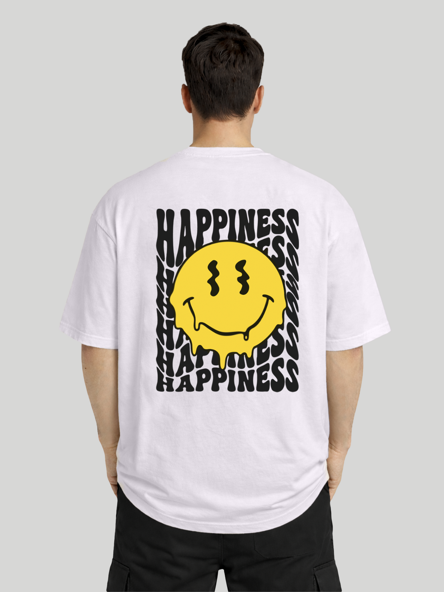 Back view of man wearing orchid oversized t-shirt with Happiness back graphic and yellow dripping smiley print