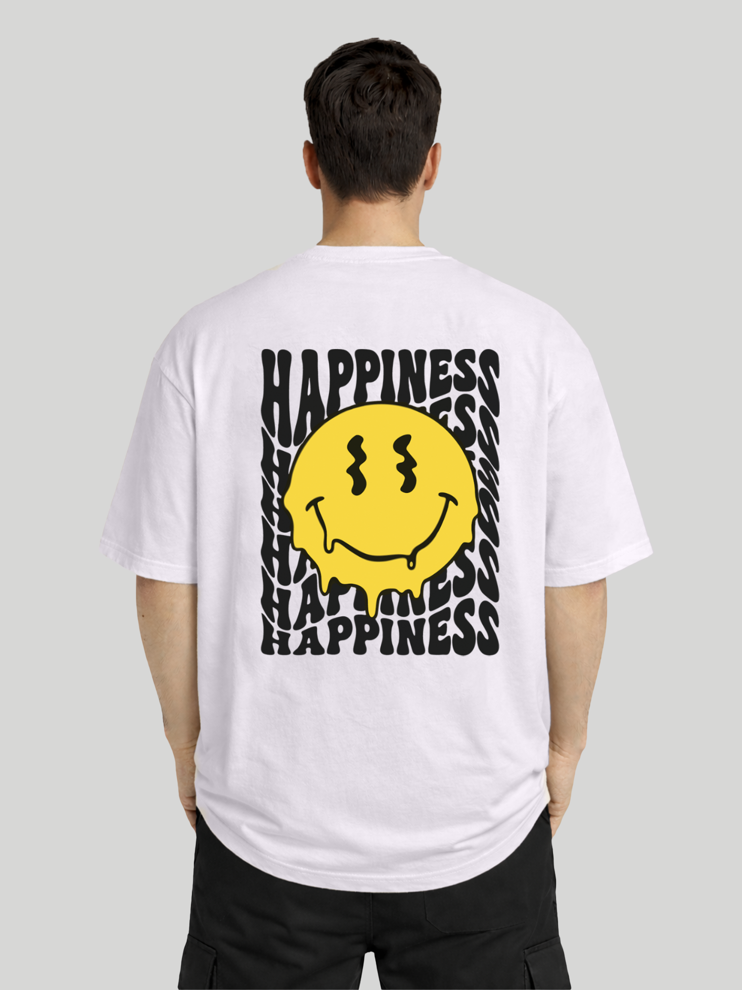 Back view of man wearing orchid oversized t-shirt with Happiness back graphic and yellow dripping smiley print