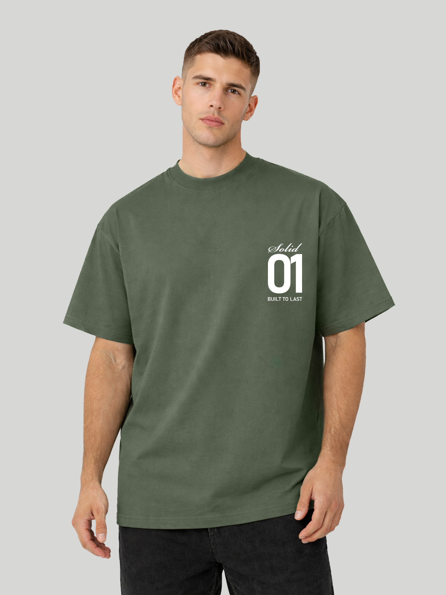 Man wearing cypress oversized t-shirt with Solid 01 chest print in relaxed tilted pose
