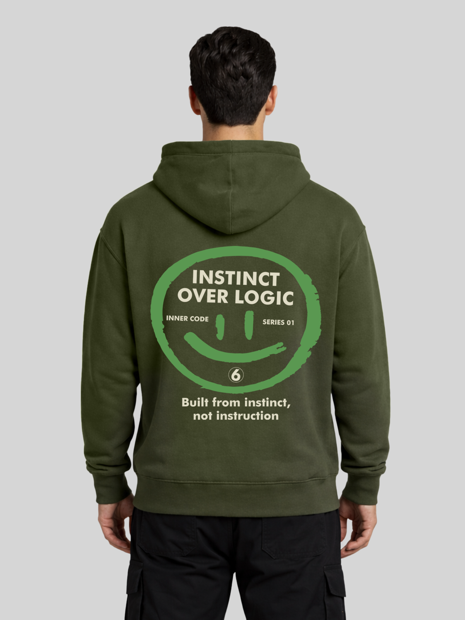 Instinct Over Logic military green graphic hoodie for men back view with bold statement print