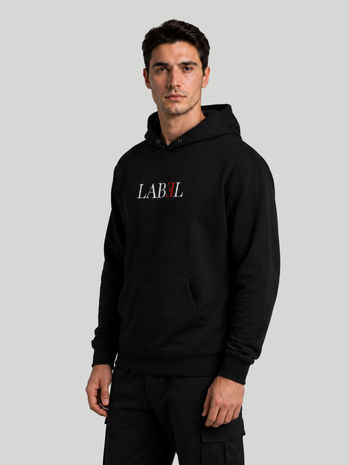 Men's LABEL black pullover hoodie with logo print in angled front pose