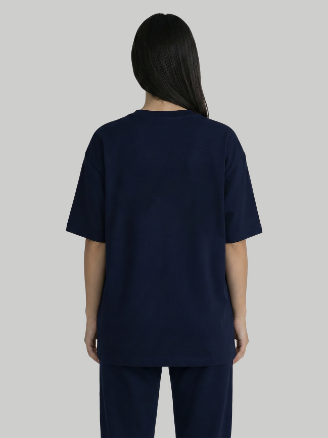 Back view of navy blue oversized graphic t-shirt for women with relaxed fit