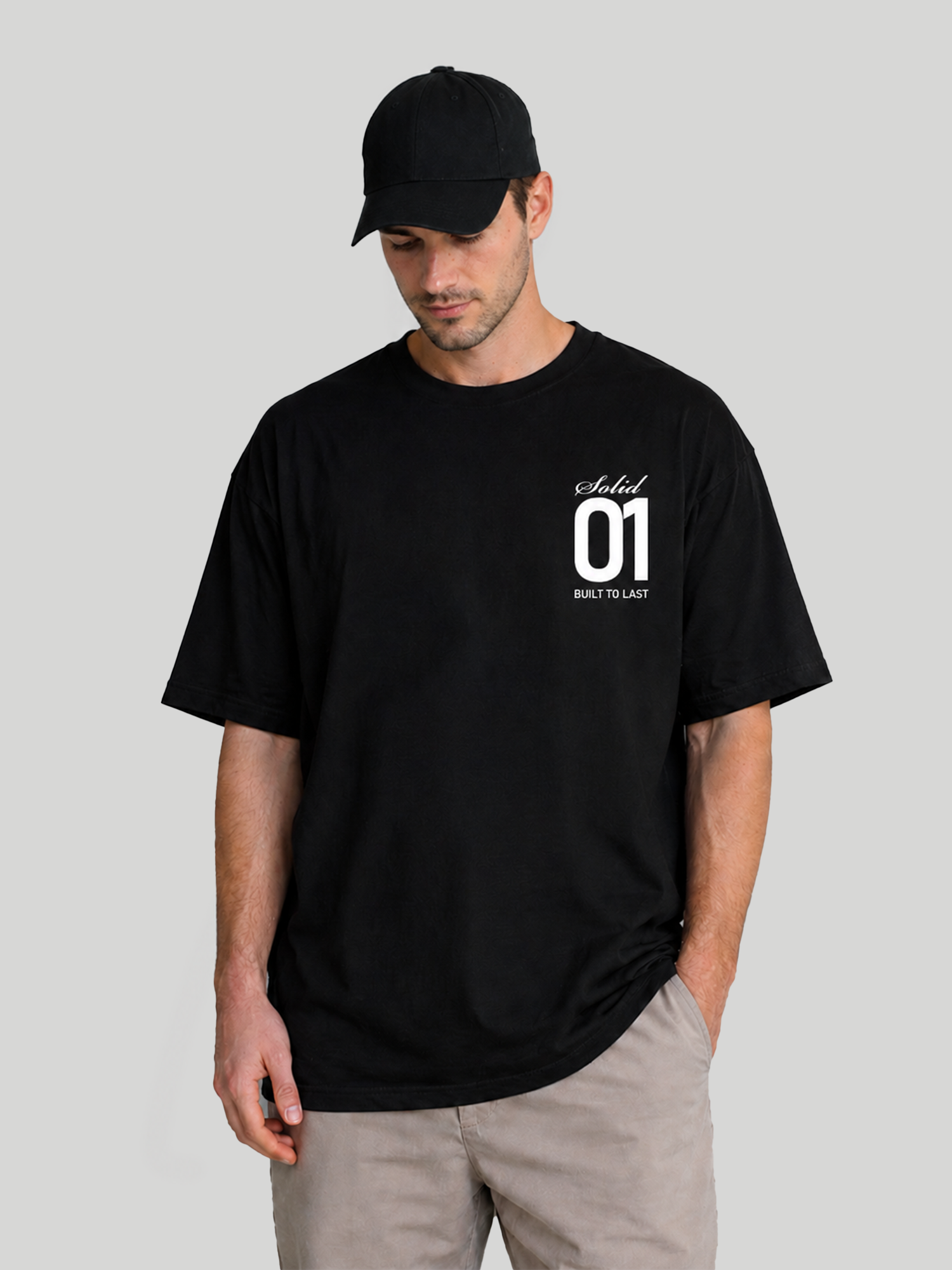 Men's Black Oversized T-Shirt Looking Down Pose – Relaxed Fit Casual Cotton Tee