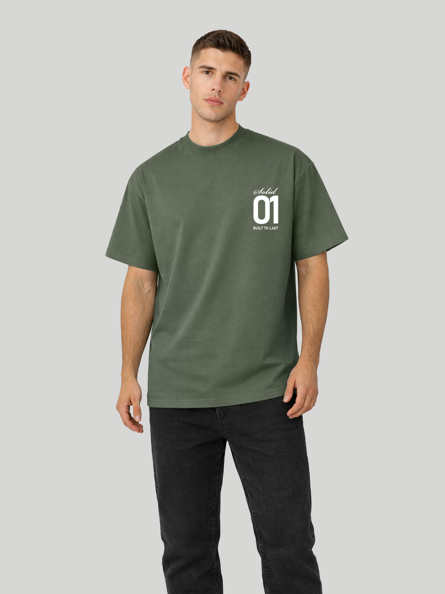 Man wearing cypress oversized t-shirt with Solid 01 chest print in angled standing pose