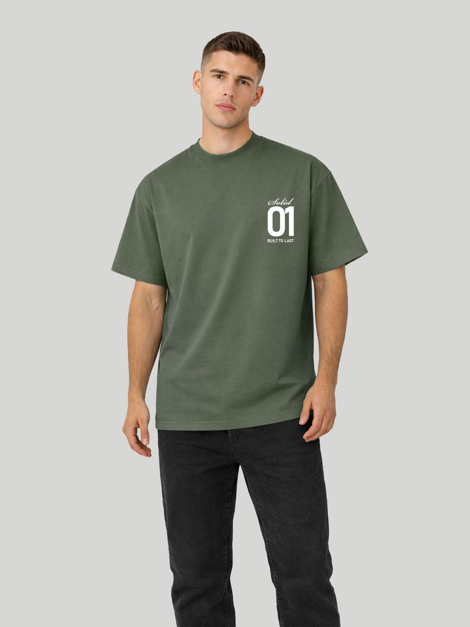 Man wearing cypress oversized t-shirt with Solid 01 chest print in angled standing pose