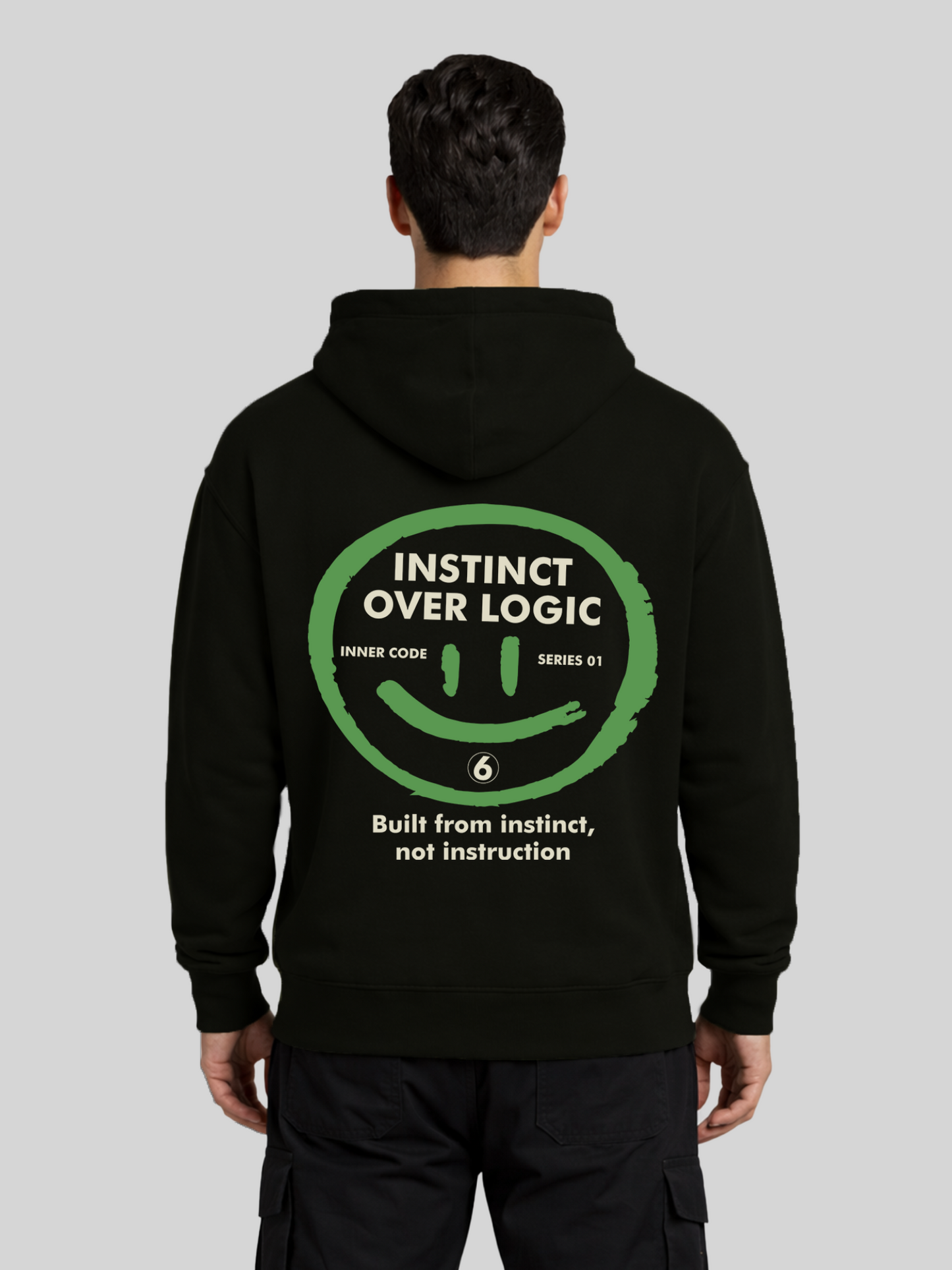 Instinct Over Logic black graphic hoodie for men back view with bold statement print