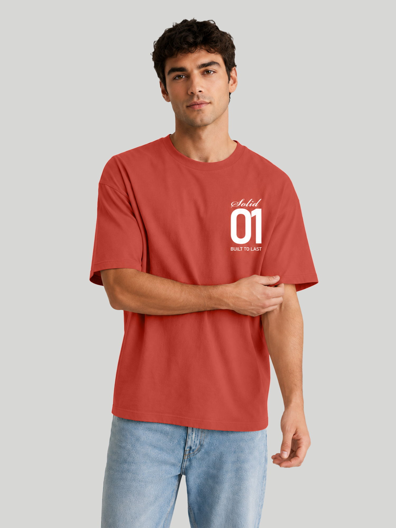 Men's Brick Red Oversized T-Shirt Sleeve Detail Pose – Relaxed Fit Streetwear Tee