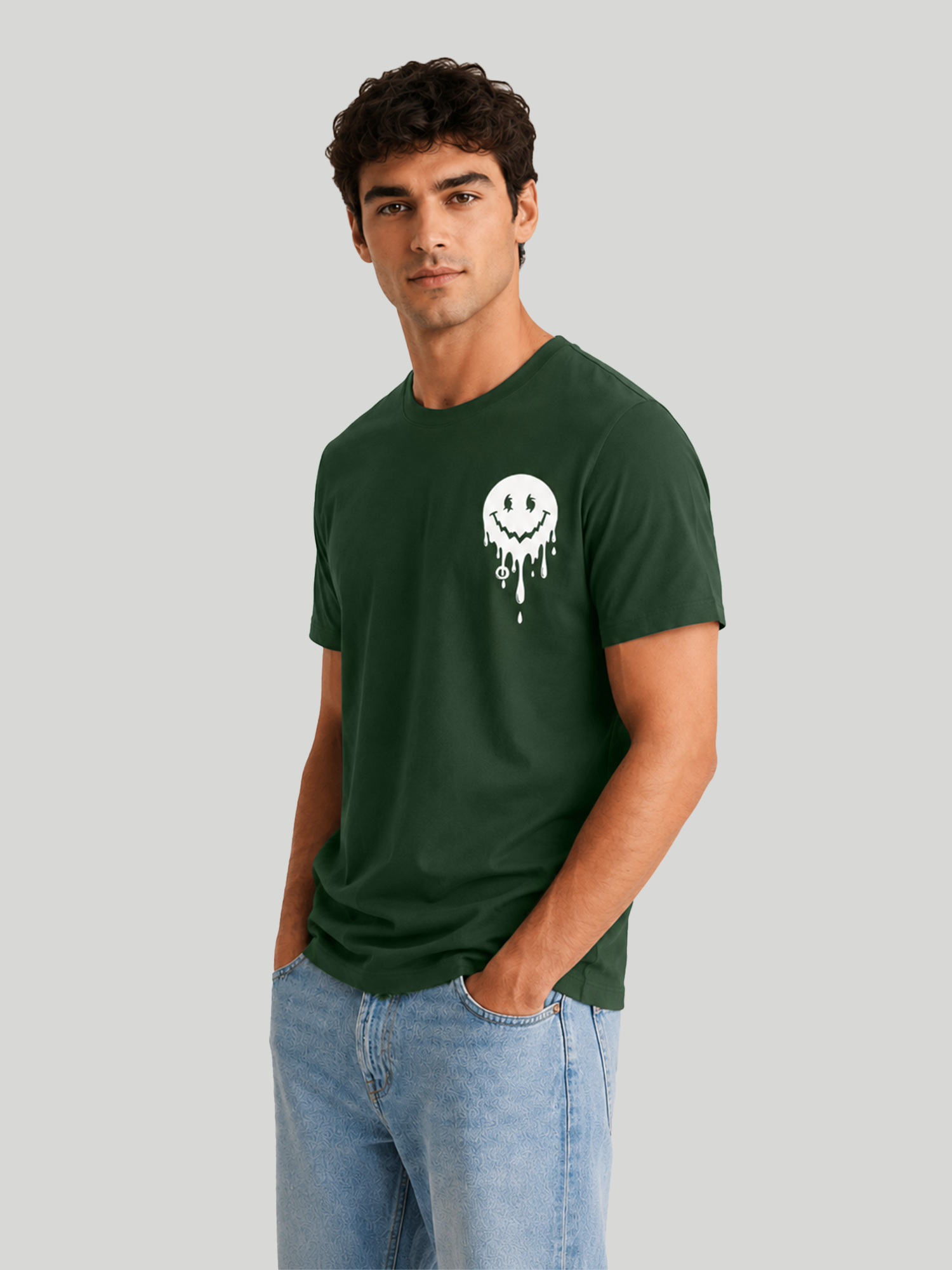 A three-quarter view of a male model looking slightly away, showcasing the comfortable shoulder drape and fit of an olive green graphic streetwear t-shirt.