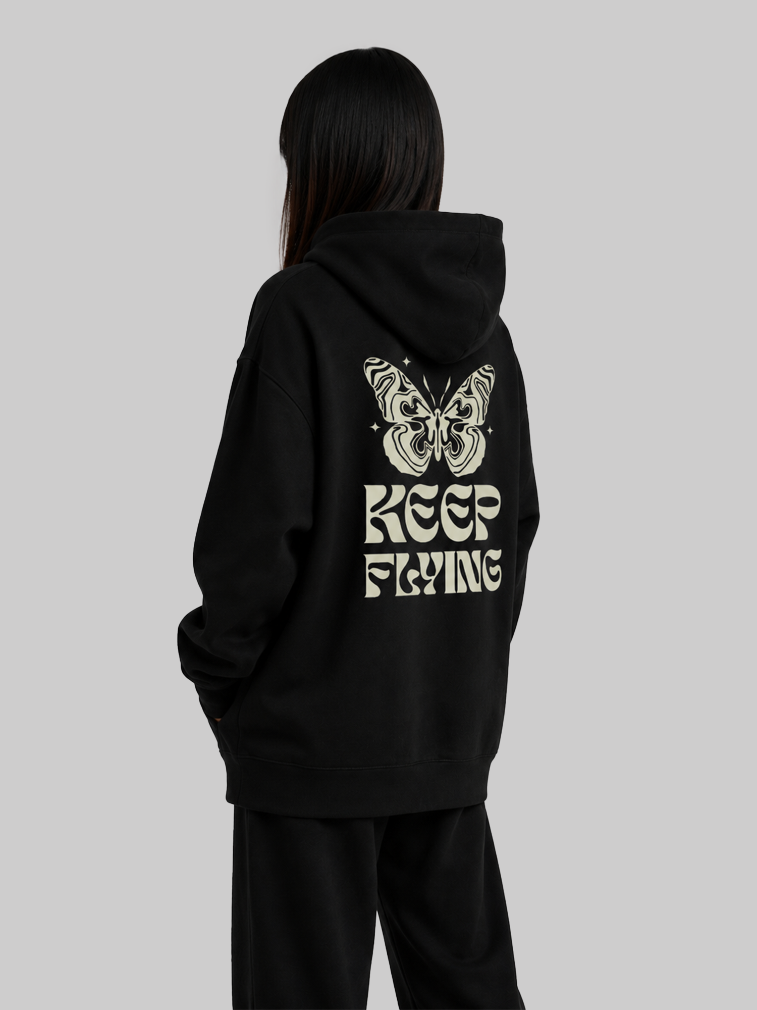 Black Women's Keep Flying Butterfly Graphic Hoodie Angled Back View