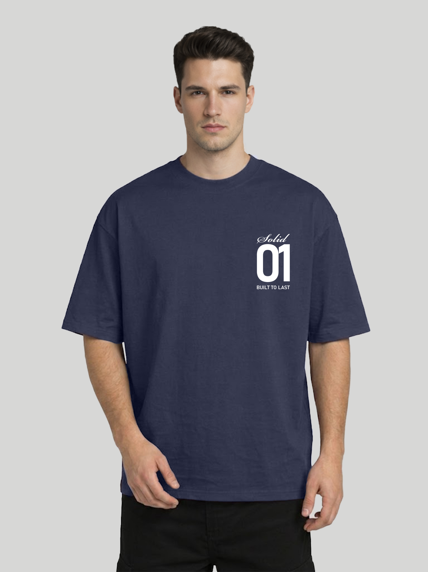 Front view of man wearing midnight blue oversized t-shirt with Solid 01 chest print