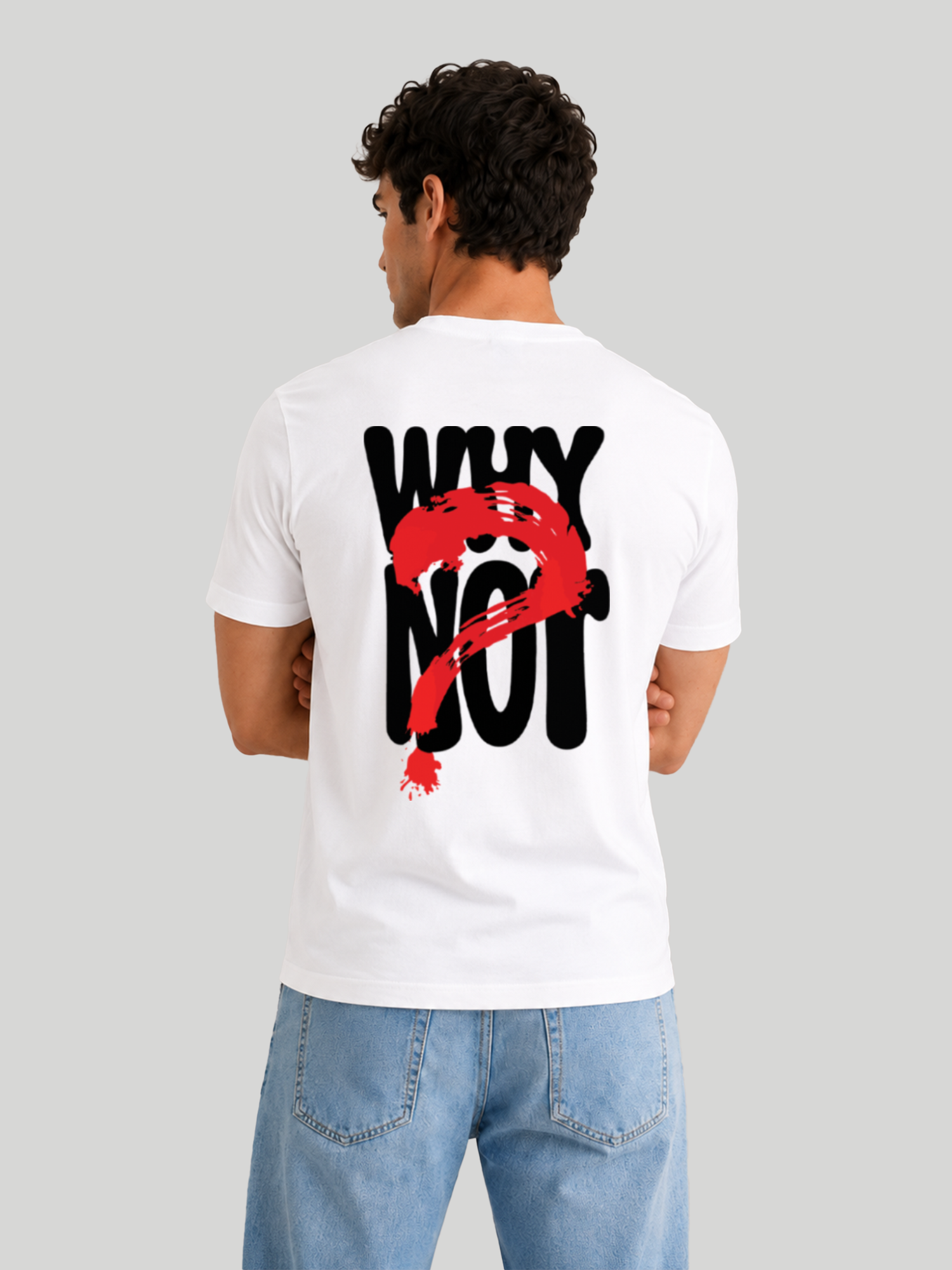 A back view of a male model with arms crossed, showcasing the regular fit and shoulder drape of a white graphic streetwear t-shirt.