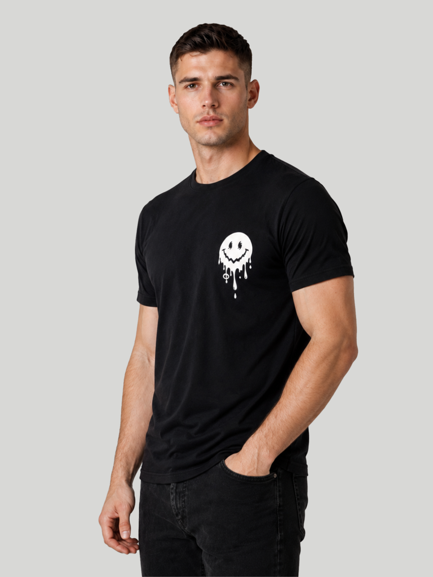 A three-quarter front view of a male model posing with his hand in his pocket, highlighting the sleeve length and neckline of a black graphic streetwear t-shirt.