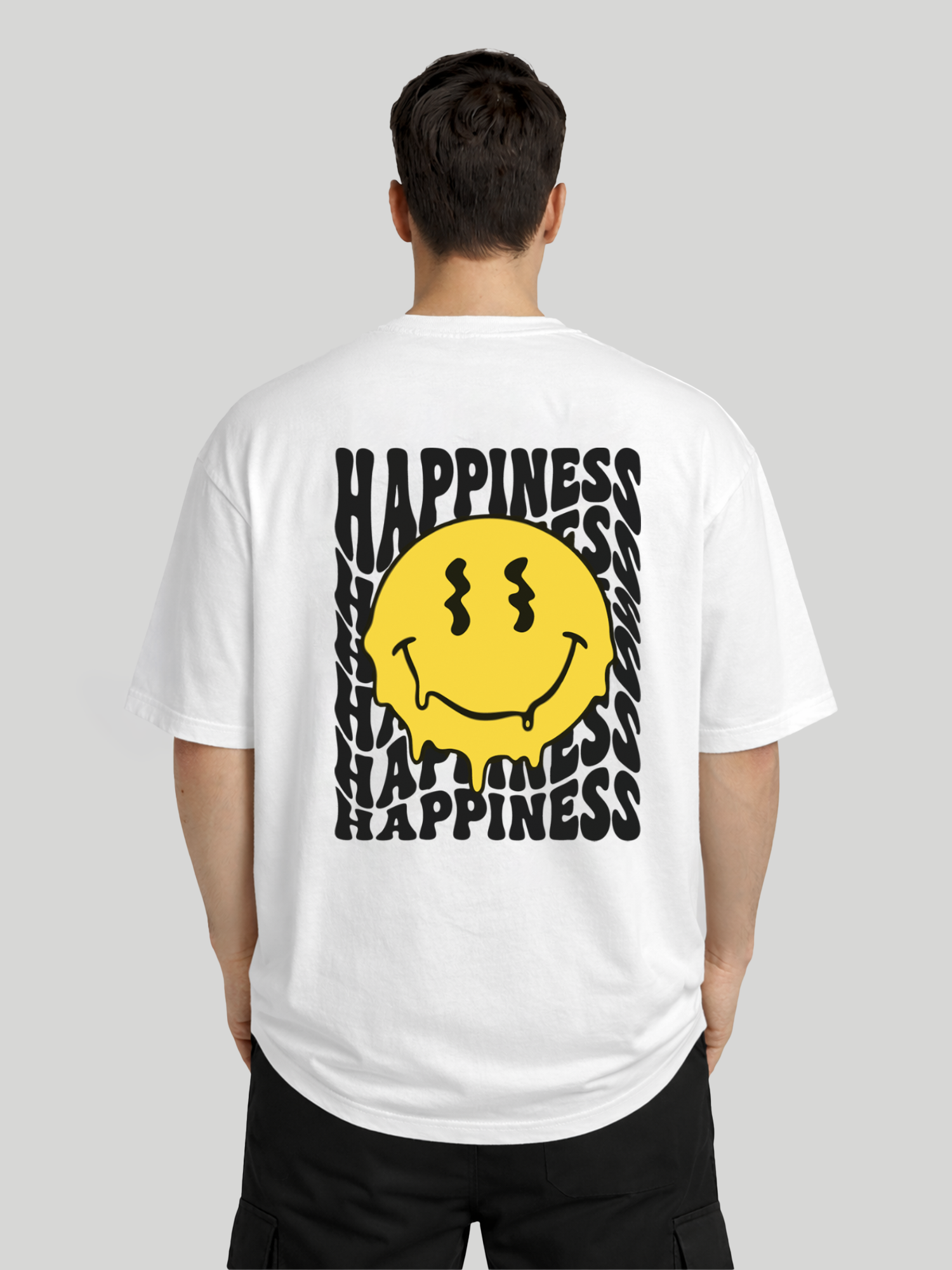 Back view of man wearing white oversized t-shirt with Happiness back graphic and yellow dripping smiley print