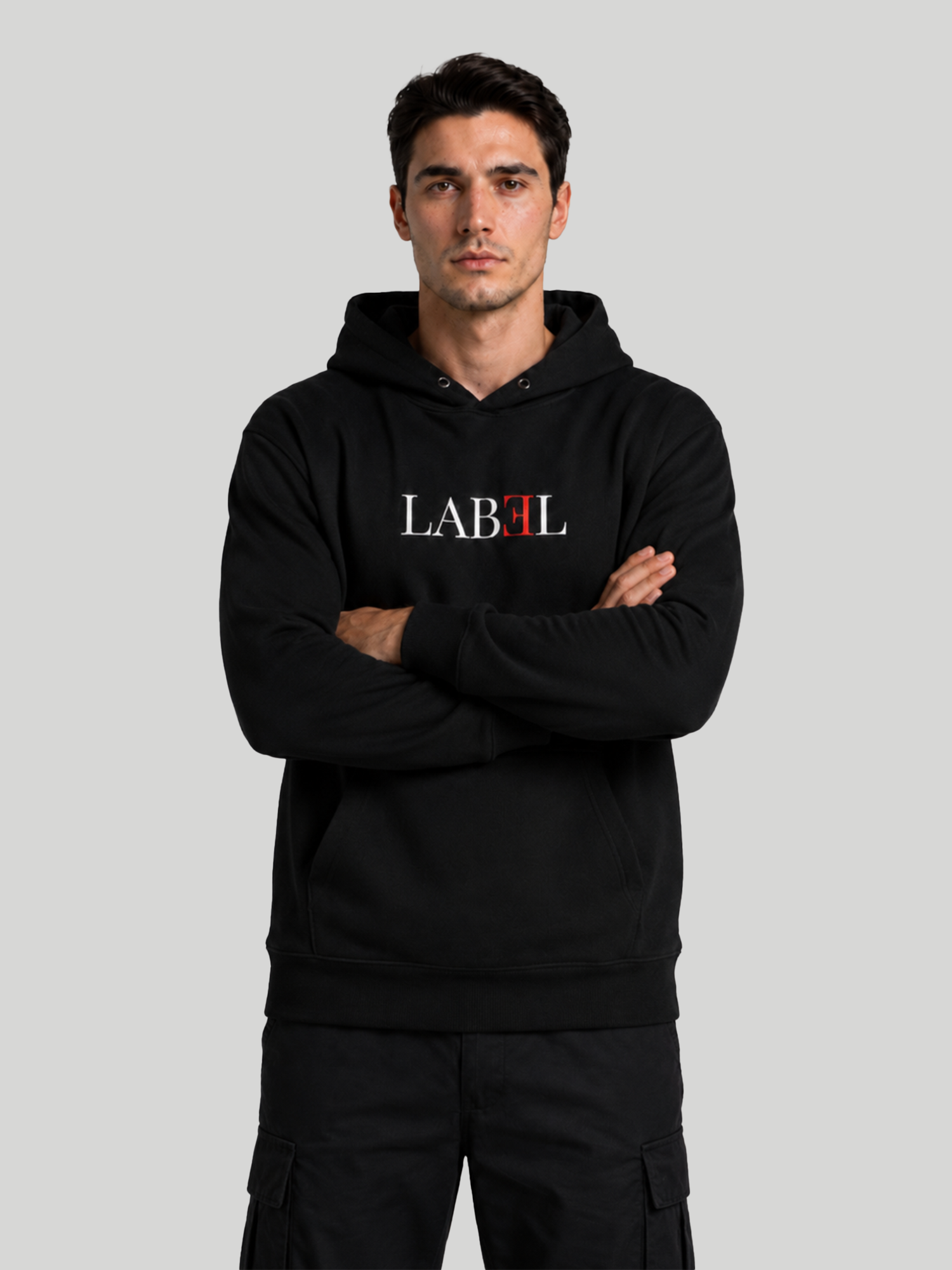 Men's LABEL black graphic hoodie with minimalist logo print and crossed arms pose