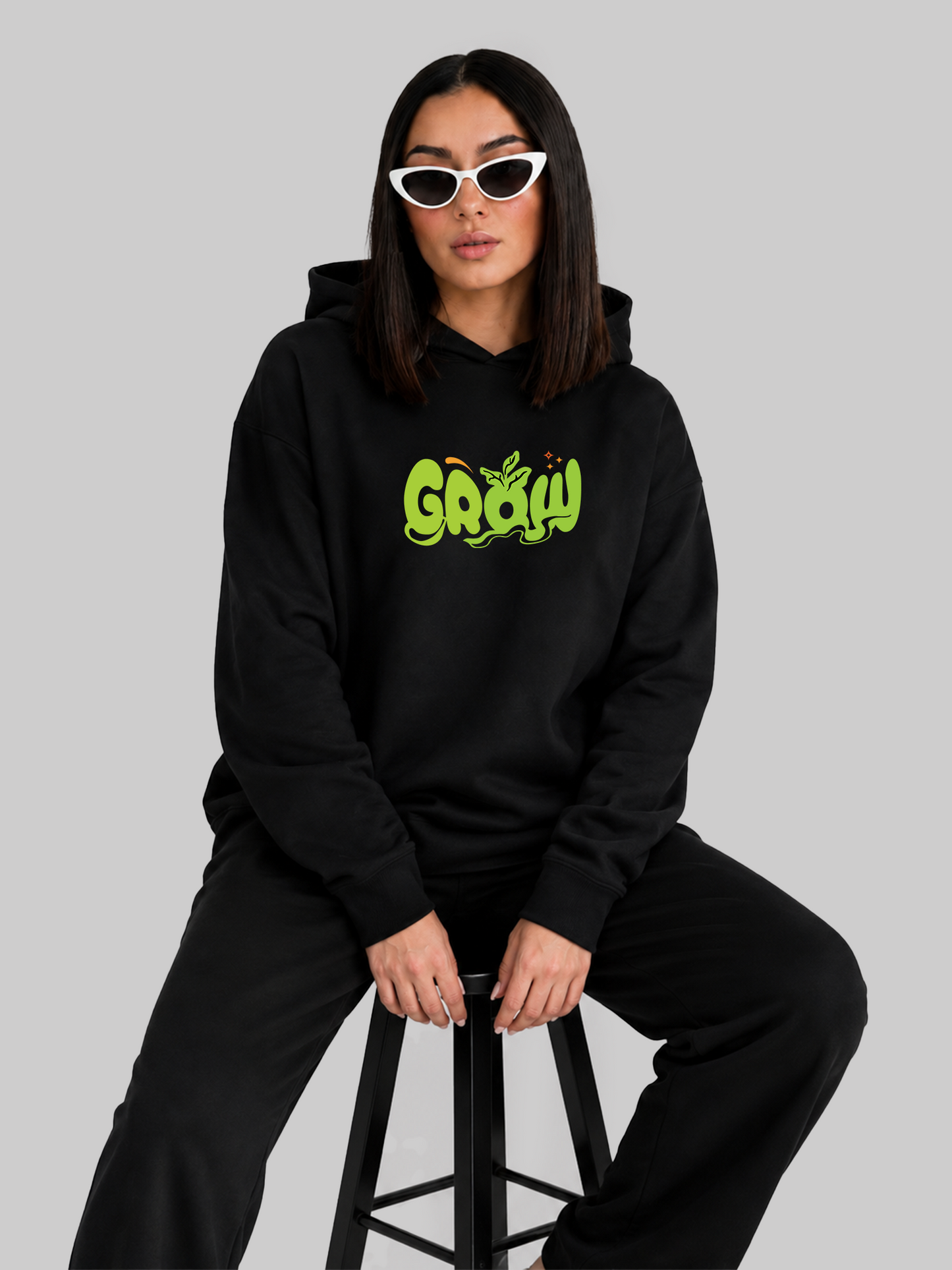 Black Grow Graphic Oversized Hoodie Seated Lifestyle Pose