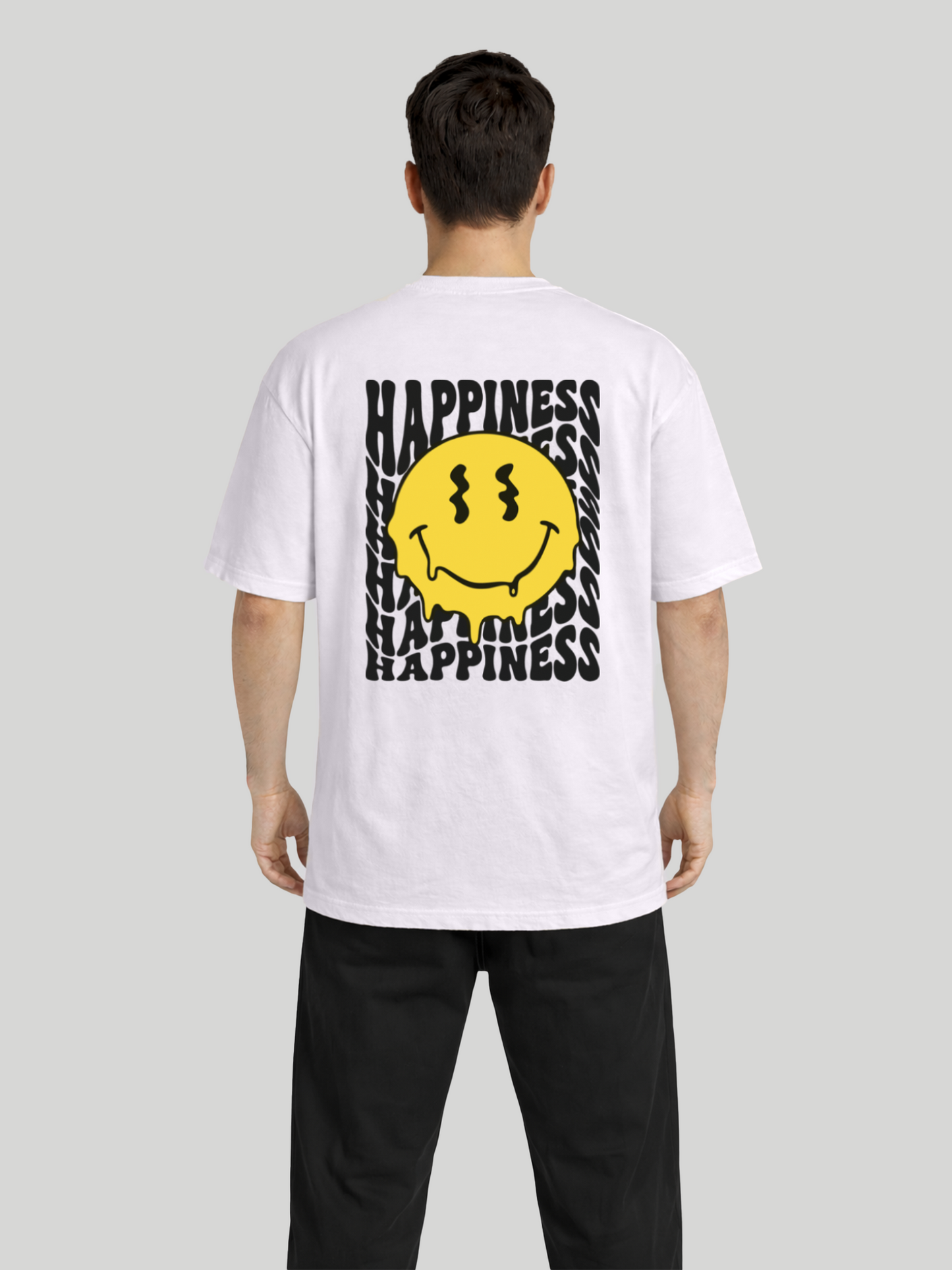 Full back view of man wearing orchid oversized t-shirt with Happiness back graphic and yellow dripping smiley print