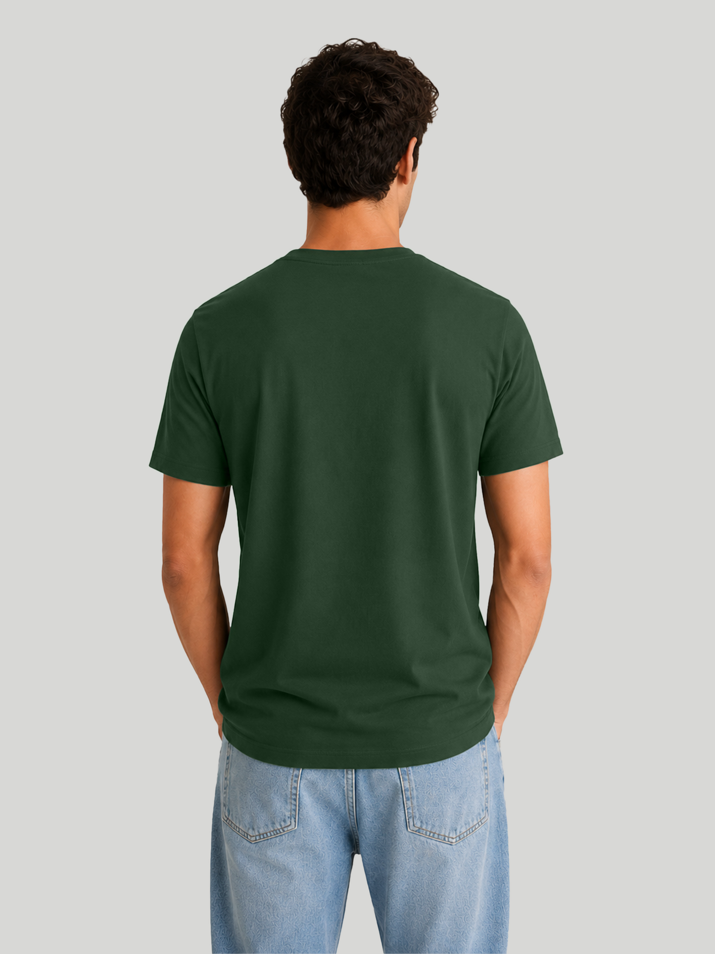 The straight rear view of a male model showcasing a solid olive green half-sleeve cotton t-shirt, highlighting the clean fit and stitching across the shoulders.