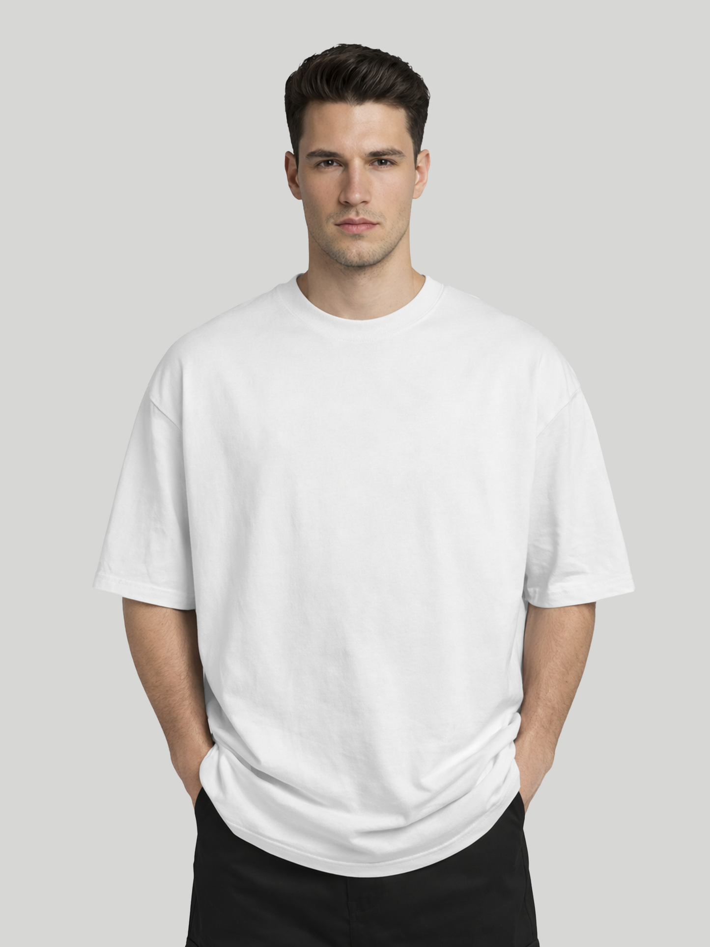 Front view of man wearing white oversized t-shirt with plain front design