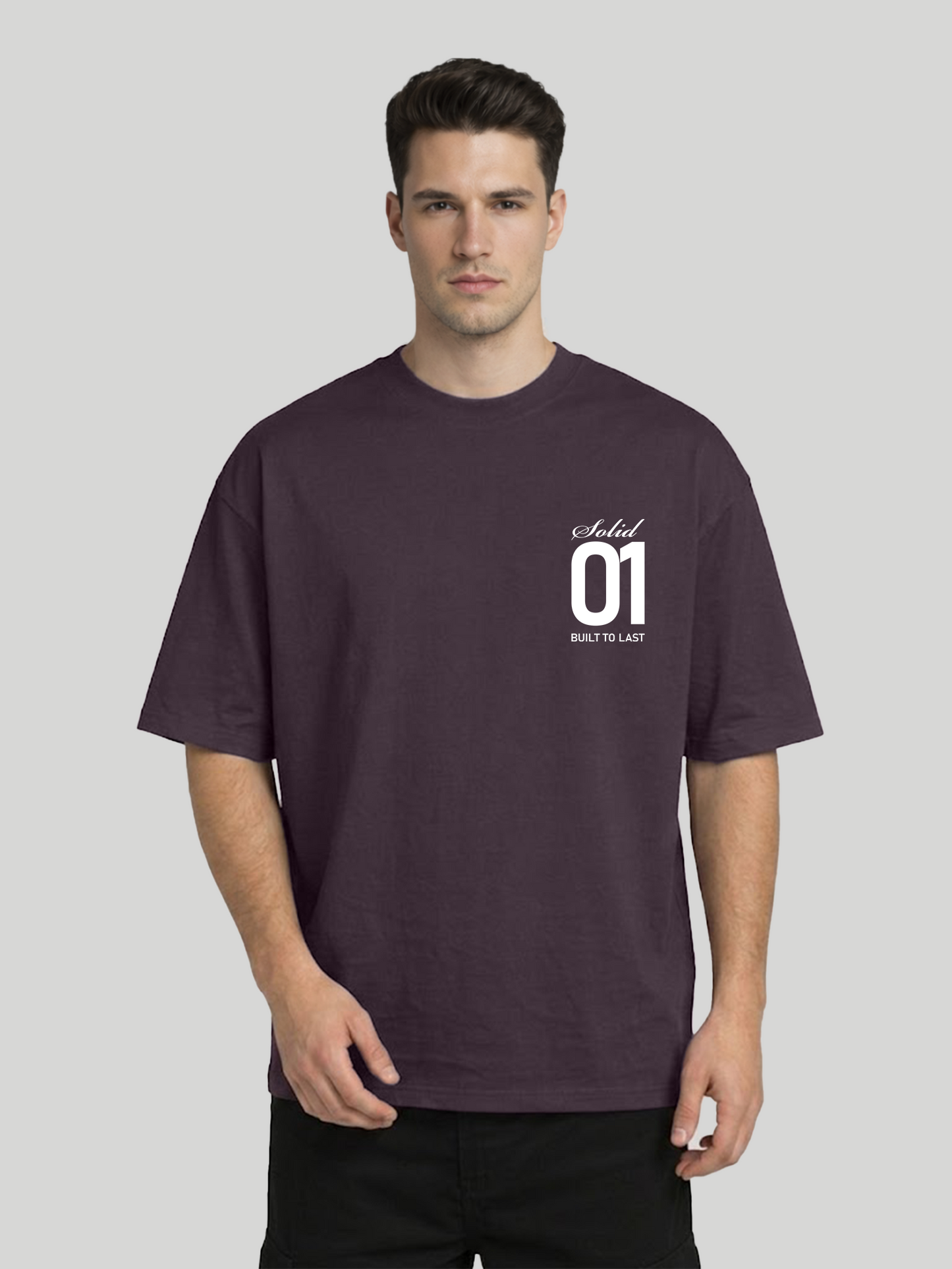 Front view of man wearing plum oversized t-shirt with Solid 01 chest print