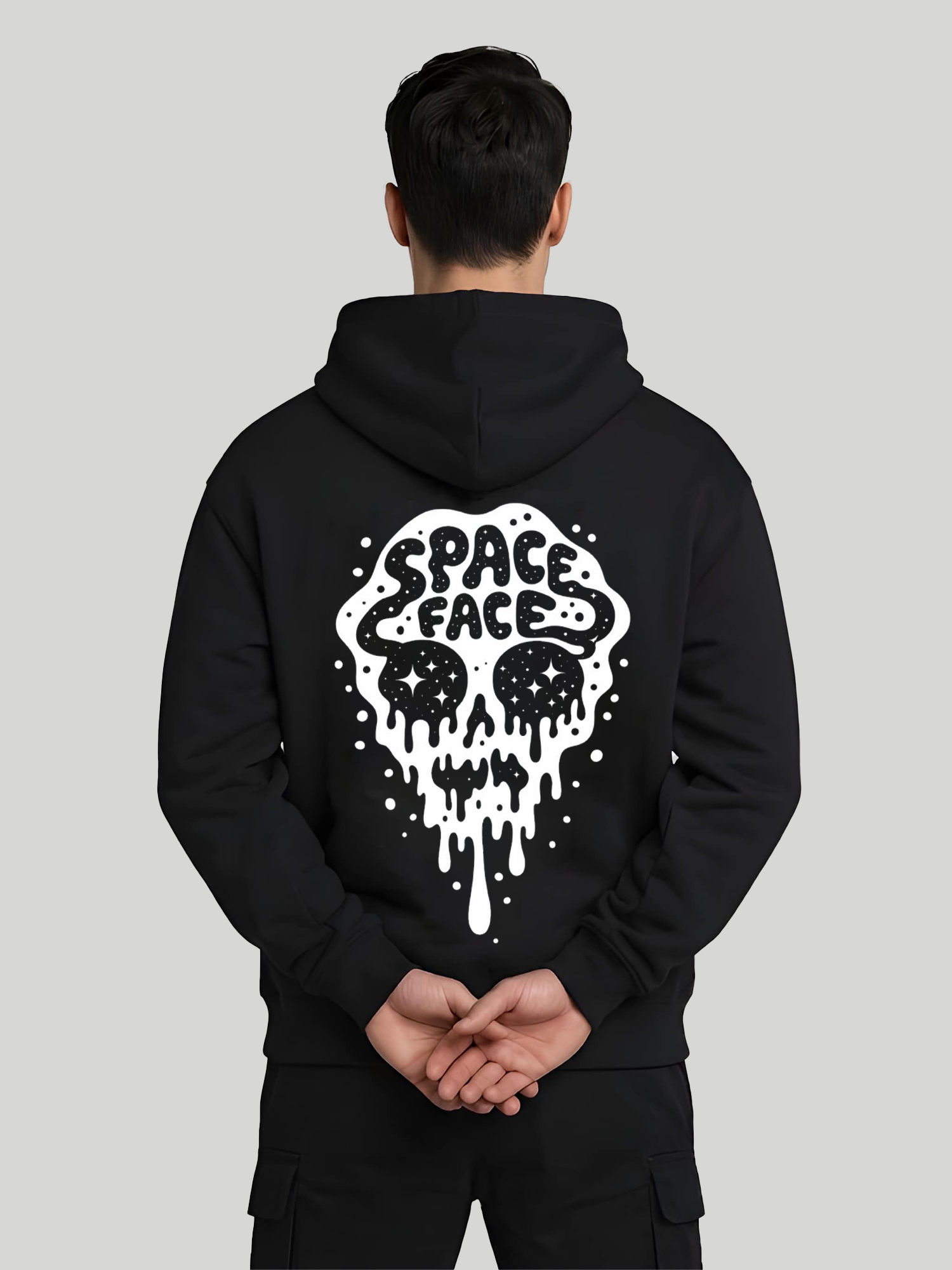 Space Face black graphic hoodie for men back view with skull print and hands behind pose