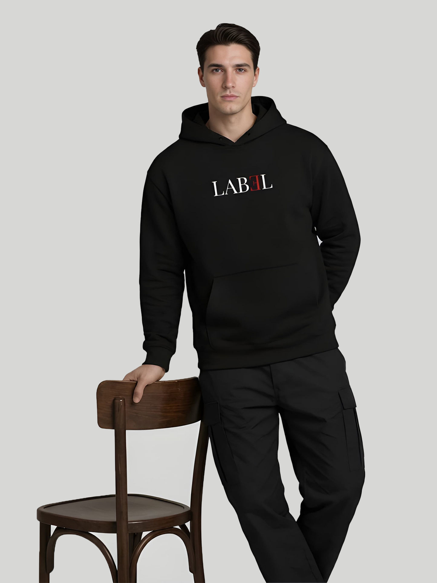 LABEL black hoodie for men casual standing pose with minimal front print